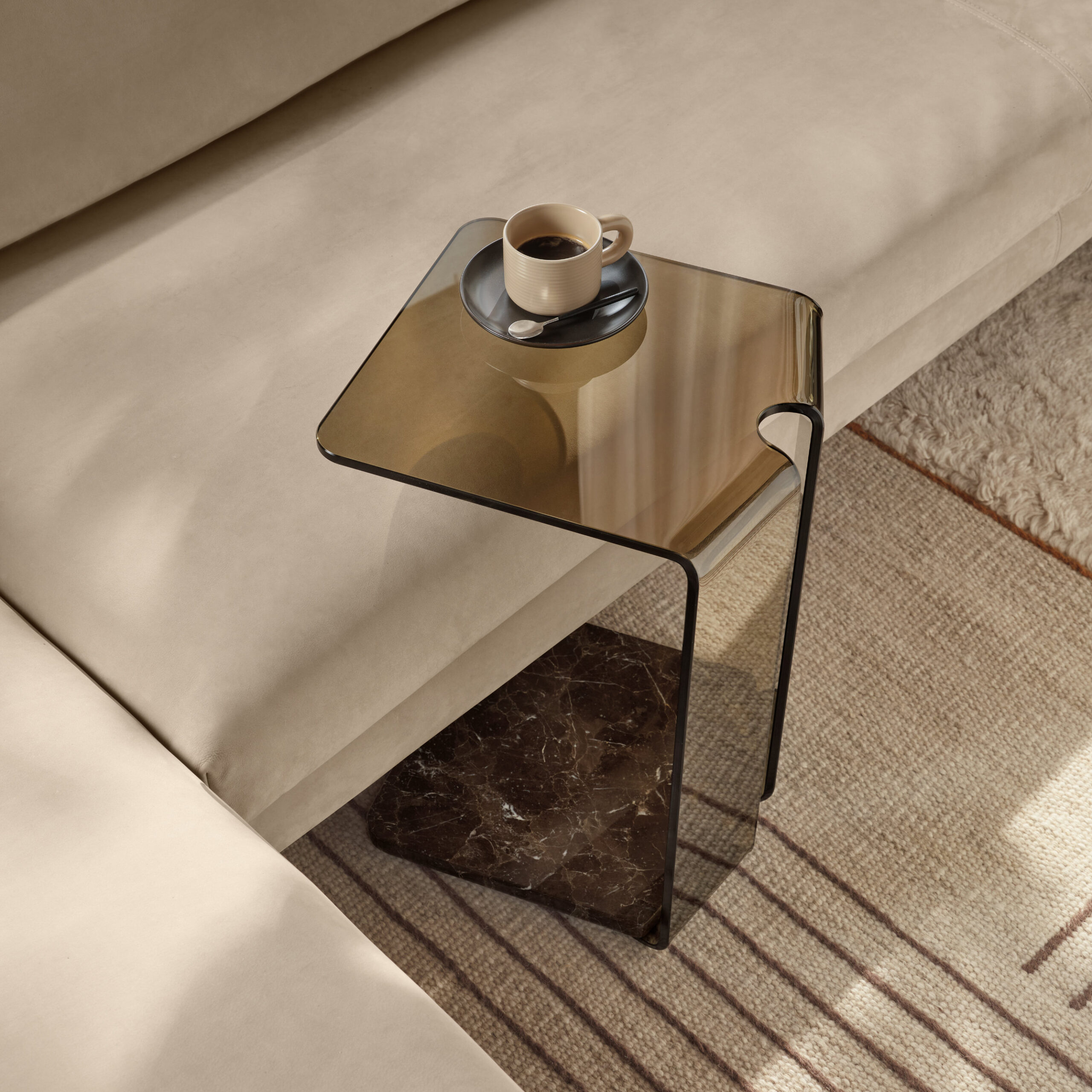 York glass side table with slender structural frame in contemporary interior