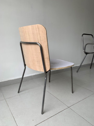 Contemporary upholstered chair with geometric backrest and elegant metal frame designed for comfort and versatility