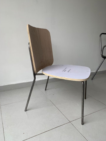 Contemporary upholstered chair with geometric backrest and elegant metal frame designed for comfort and versatility