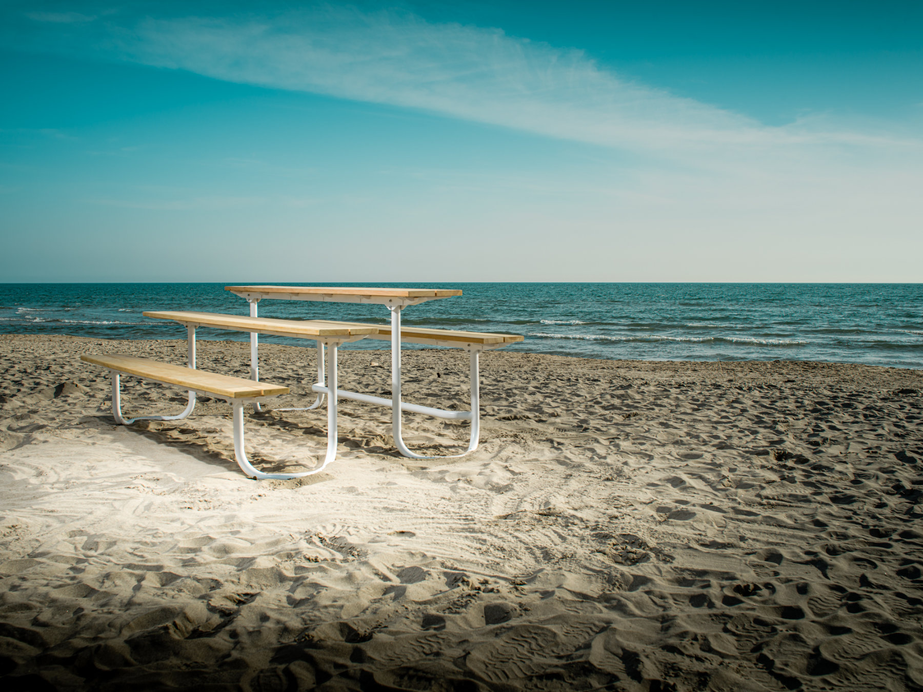 Modular outdoor bench and picnic table with refined geometry and flexible configurations designed for public space