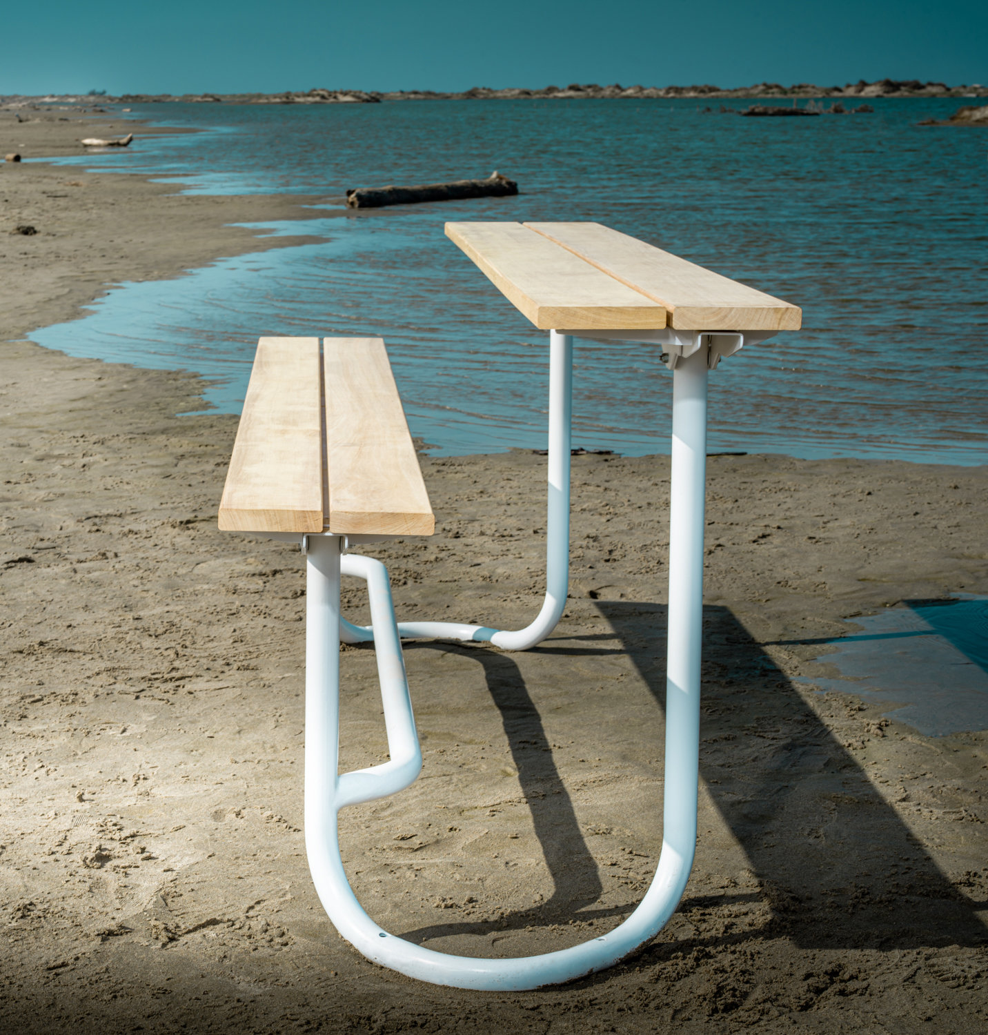 Modular outdoor bench and picnic table with refined geometry and flexible configurations designed for public space