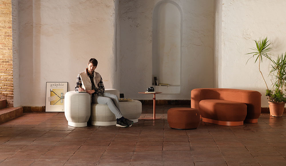 Brisa modular poufs arranged in a curved lounge configuration