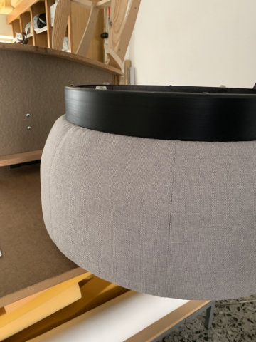 Brisa modular poufs arranged in a curved lounge configuration