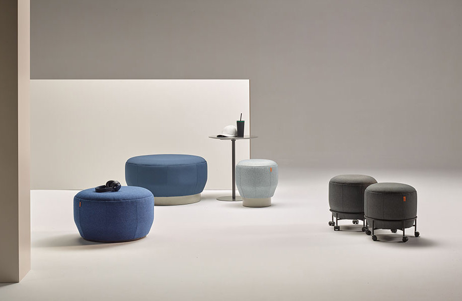 Brisa modular poufs arranged in a curved lounge configuration