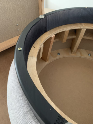 Brisa modular poufs arranged in a curved lounge configuration