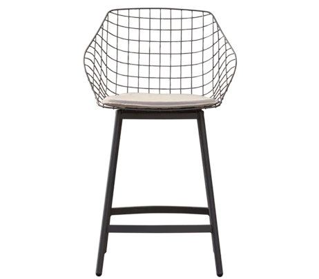 Canasta outdoor chair with woven wire shell in terrace setting