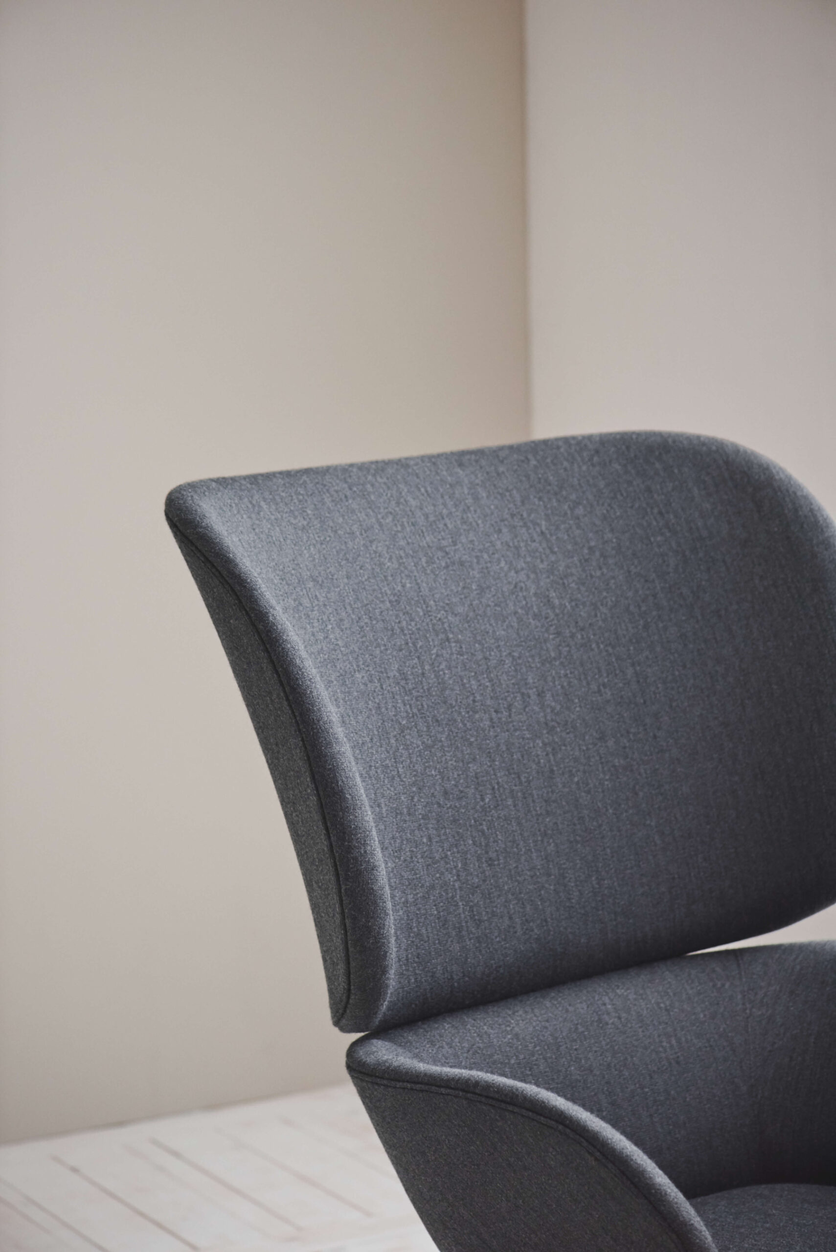 Carmen armchair in contemporary interior showing refined silhouette and tactile upholstery