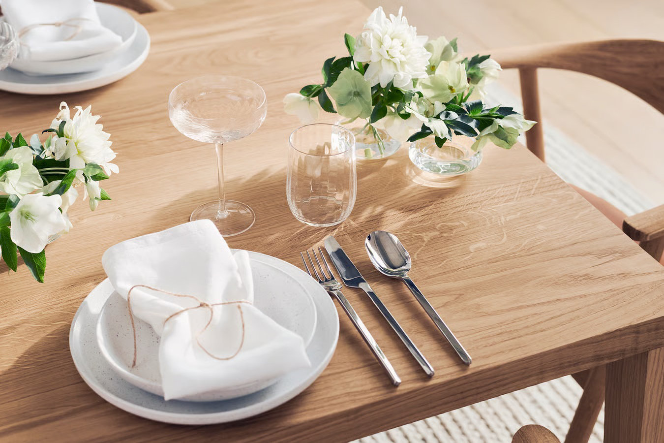 Carved cutlery set on a minimalist dining table