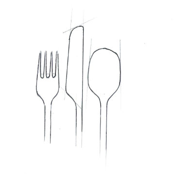 Carved cutlery set on a minimalist dining table
