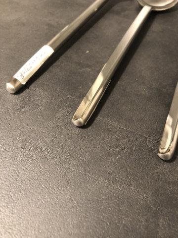 Carved cutlery set on a minimalist dining table
