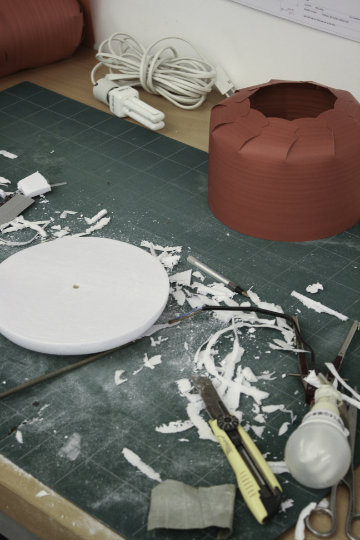 Chou lamp by LZF with folded silhouette illuminating interior