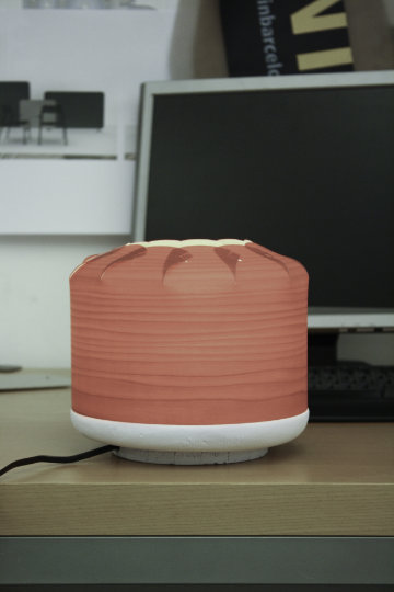 Chou lamp by LZF with folded silhouette illuminating interior