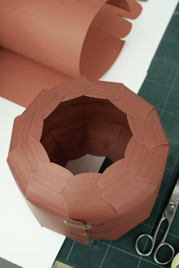 Chou lamp by LZF with folded silhouette illuminating interior