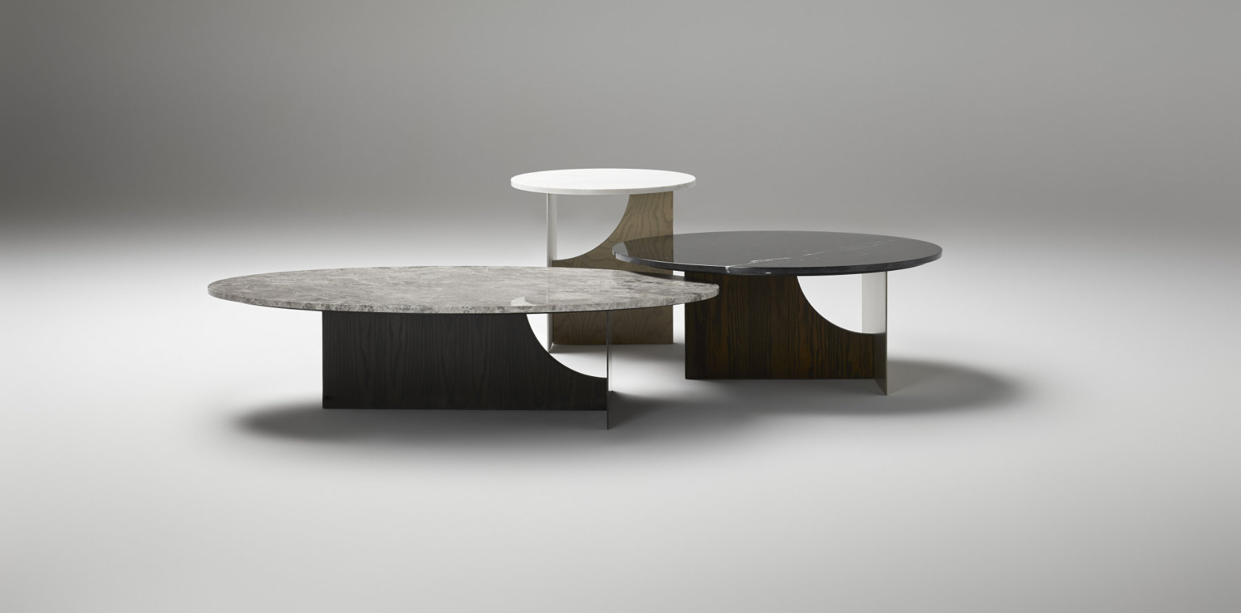 Coro coffee tables arranged in layered composition