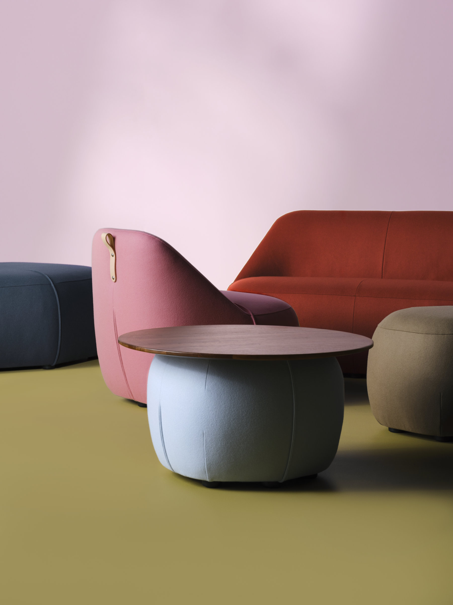 Modular seating configuration formed by hexagonal upholstered units in an open workspace