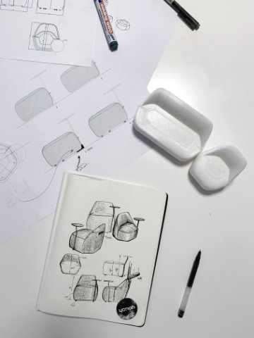Modular seating configuration formed by hexagonal upholstered units in an open workspace