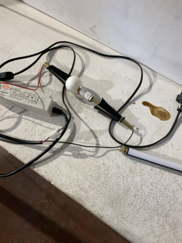 Dew lamp with softly glowing body in modern interior