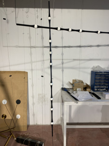 Dew lamp with softly glowing body in modern interior