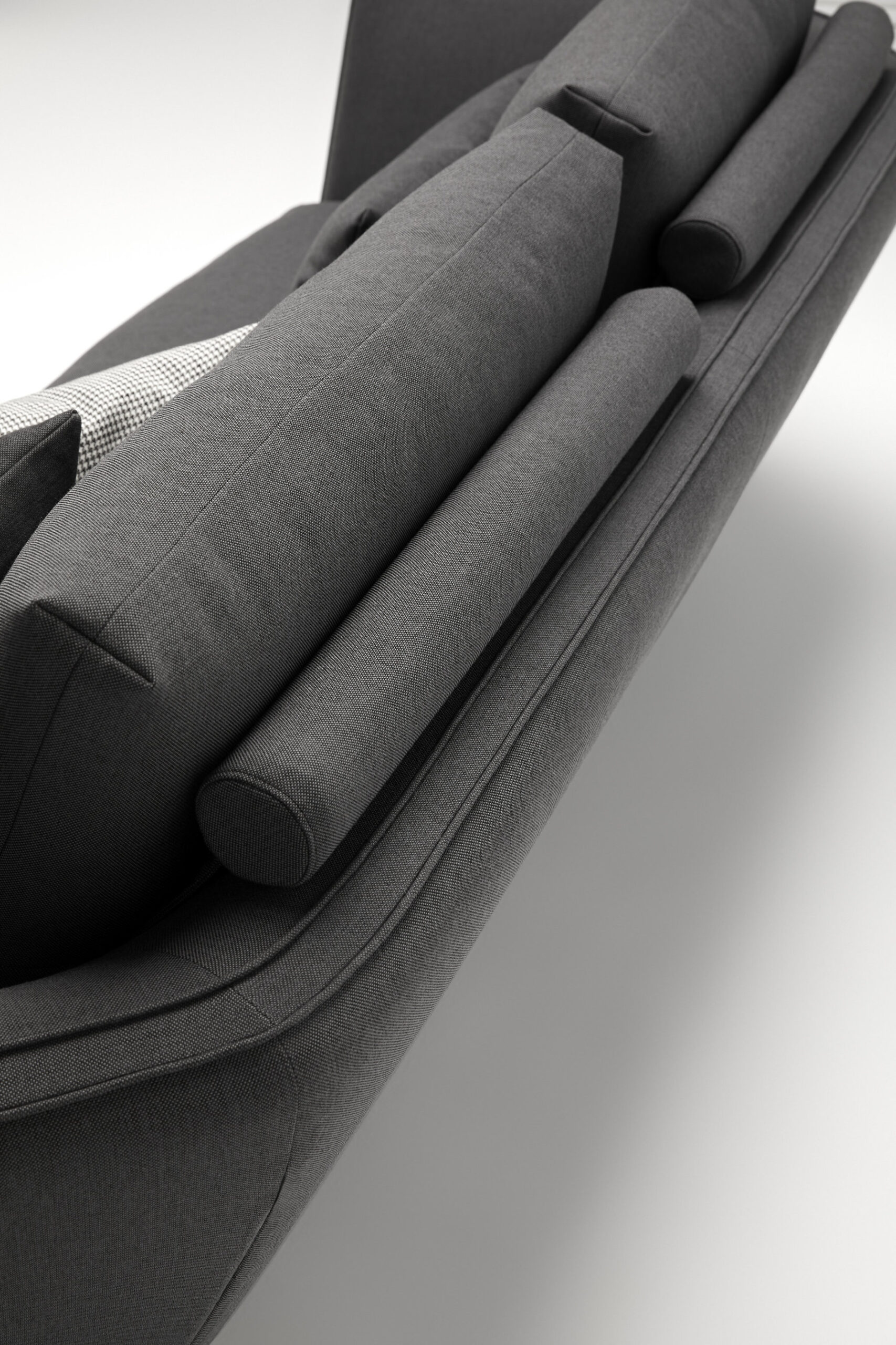 Disc sofa with curved backrest in contemporary lounge setting