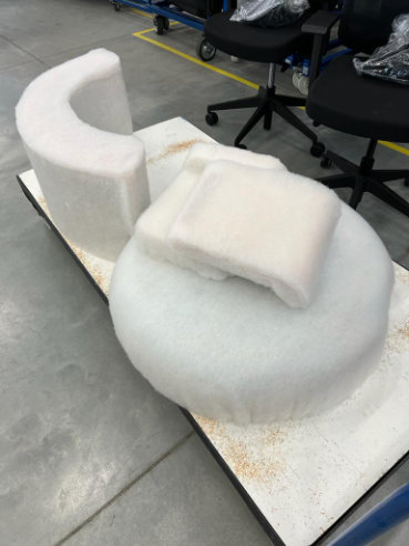 Disc sofa with curved backrest in contemporary lounge setting