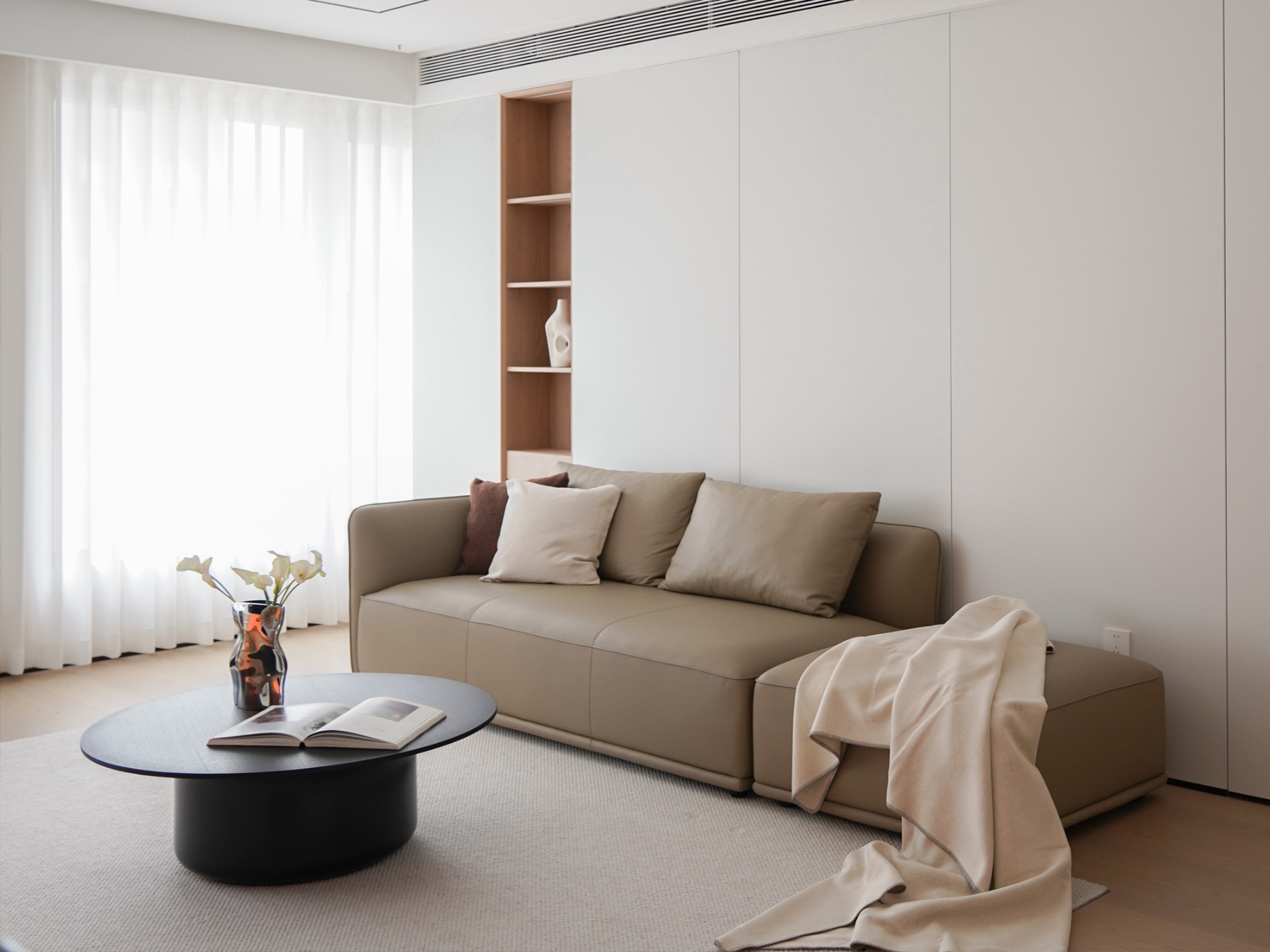 Fil sofa in contemporary interior showing slender profile and balanced form