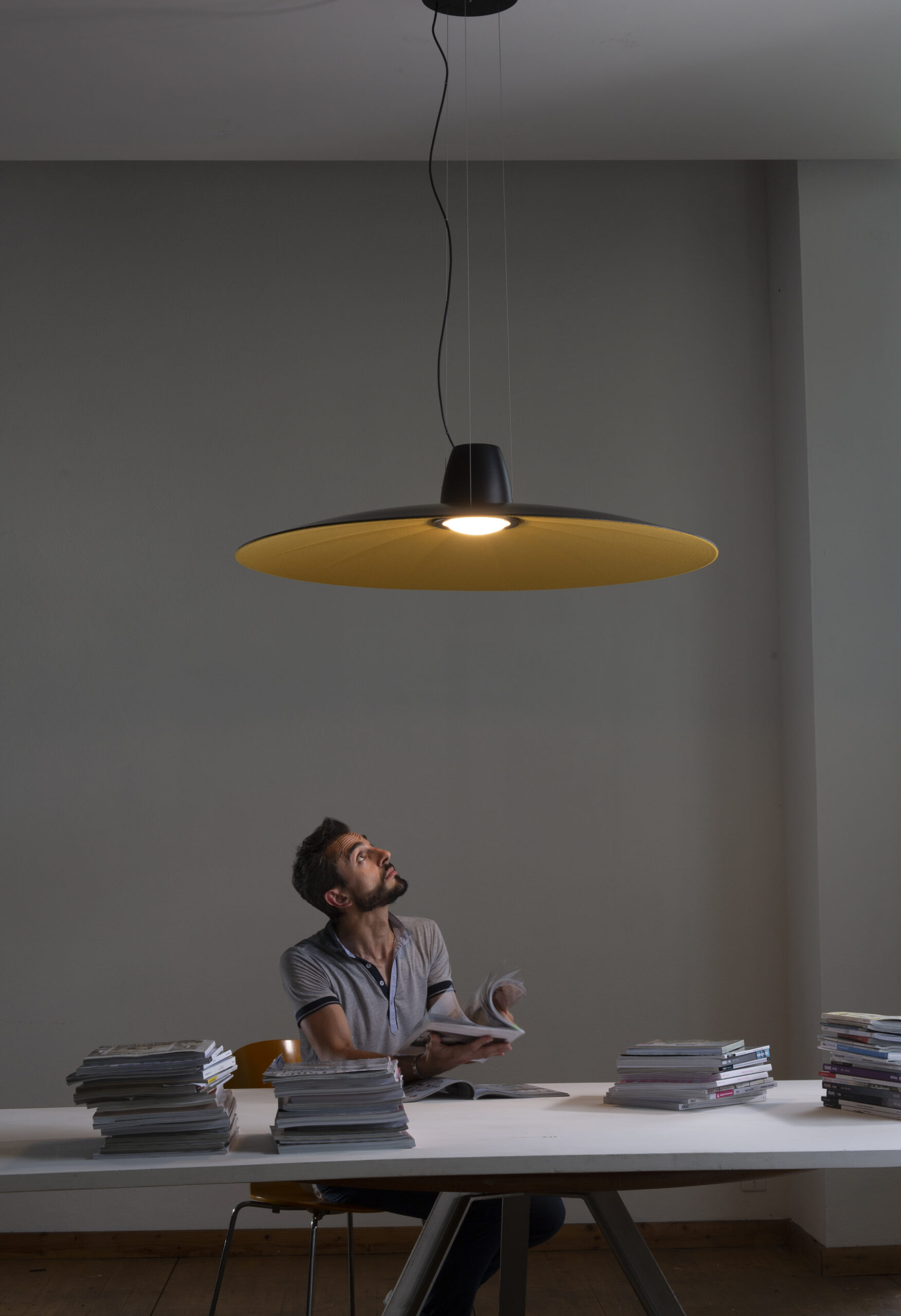 Lent acoustic lamp in contemporary interior with soft lighting and sound-absorbing surface