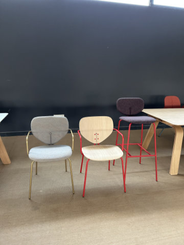 Contemporary upholstered chair with rounded organic silhouette inspired by the soft curves of a ladybird