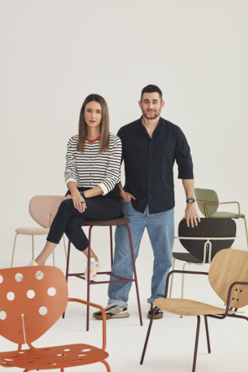 Contemporary upholstered chair with rounded organic silhouette inspired by the soft curves of a ladybird