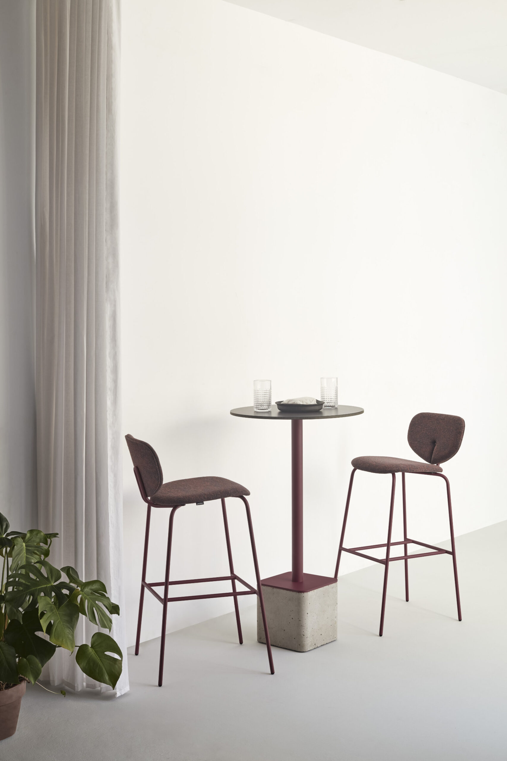 Contemporary upholstered chair with rounded organic silhouette inspired by the soft curves of a ladybird