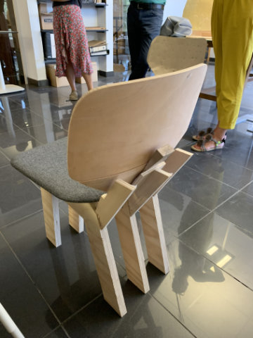 Contemporary upholstered chair with rounded organic silhouette inspired by the soft curves of a ladybird