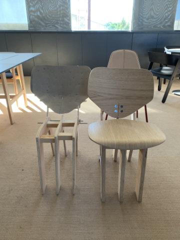 Contemporary upholstered chair with rounded organic silhouette inspired by the soft curves of a ladybird