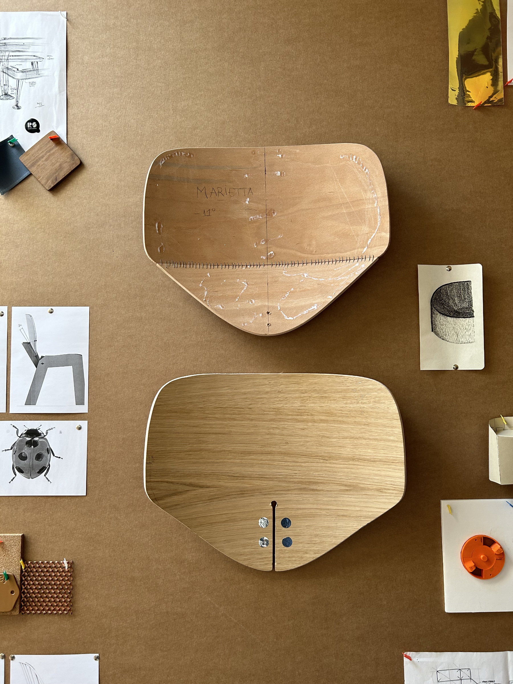Contemporary upholstered chair with rounded organic silhouette inspired by the soft curves of a ladybird
