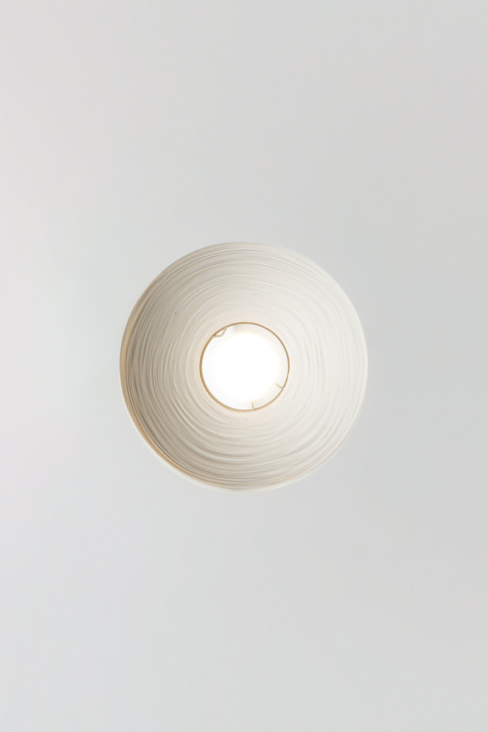 Mediterranean Collection ceiling luminaire in Crismosil featuring radial textured surface and warm integrated LED light