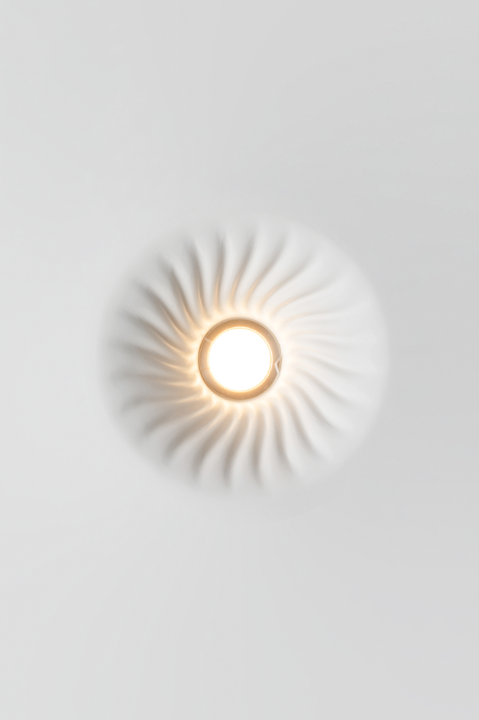 Mediterranean Collection ceiling luminaire in Crismosil featuring radial textured surface and warm integrated LED light
