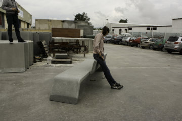Mimetic urban bench in concrete integrated into public space