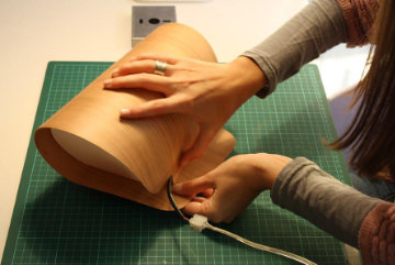 Pleg lamp with folded geometric form casting soft light