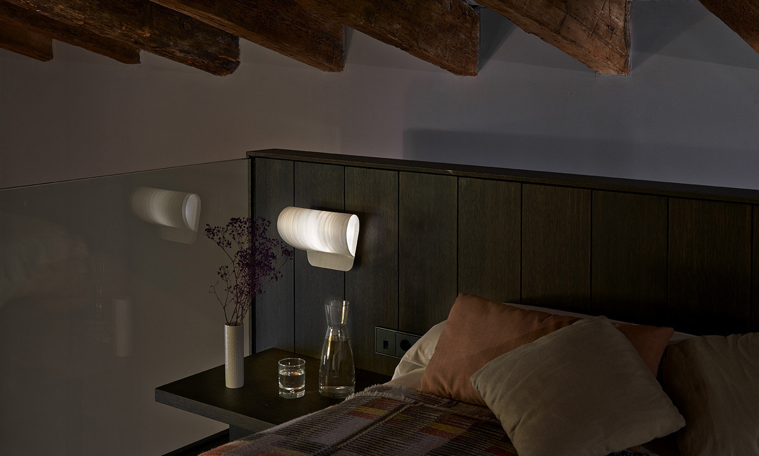 Pleg lamp with folded geometric form casting soft light