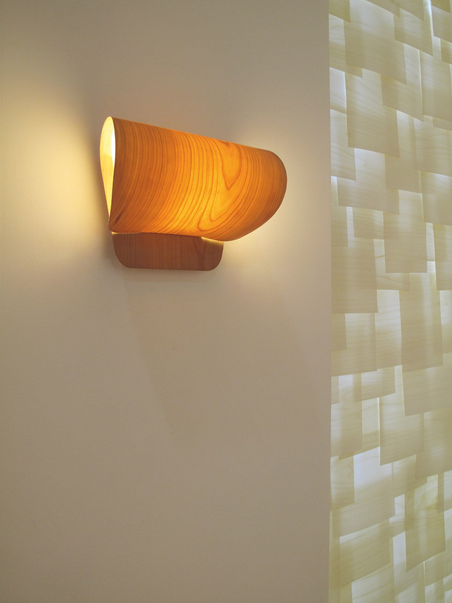 Pleg lamp with folded geometric form casting soft light