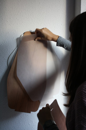 Pleg lamp with folded geometric form casting soft light