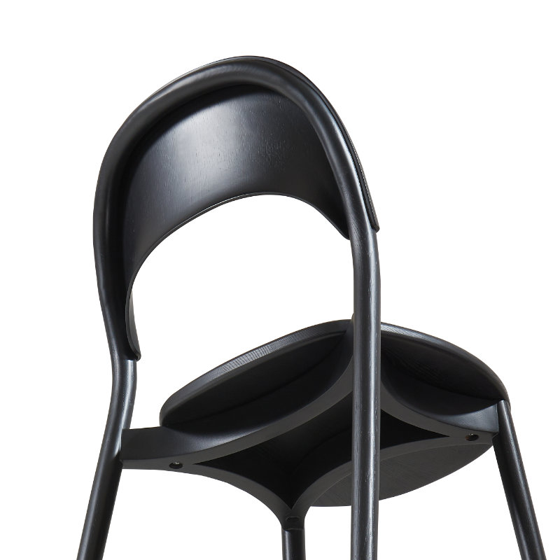Elegant sculptural chair Ronda with dynamic circular form and refined proportions