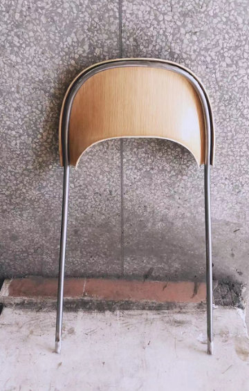 Elegant sculptural chair Ronda with dynamic circular form and refined proportions