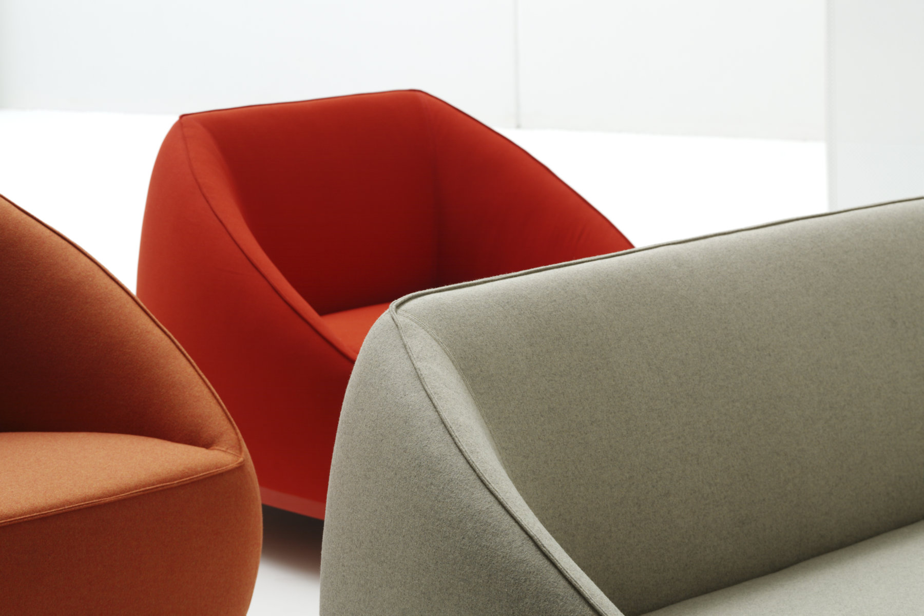 Sumo seating collection by Yonoh for Sancal with upholstered volumes and wooden base