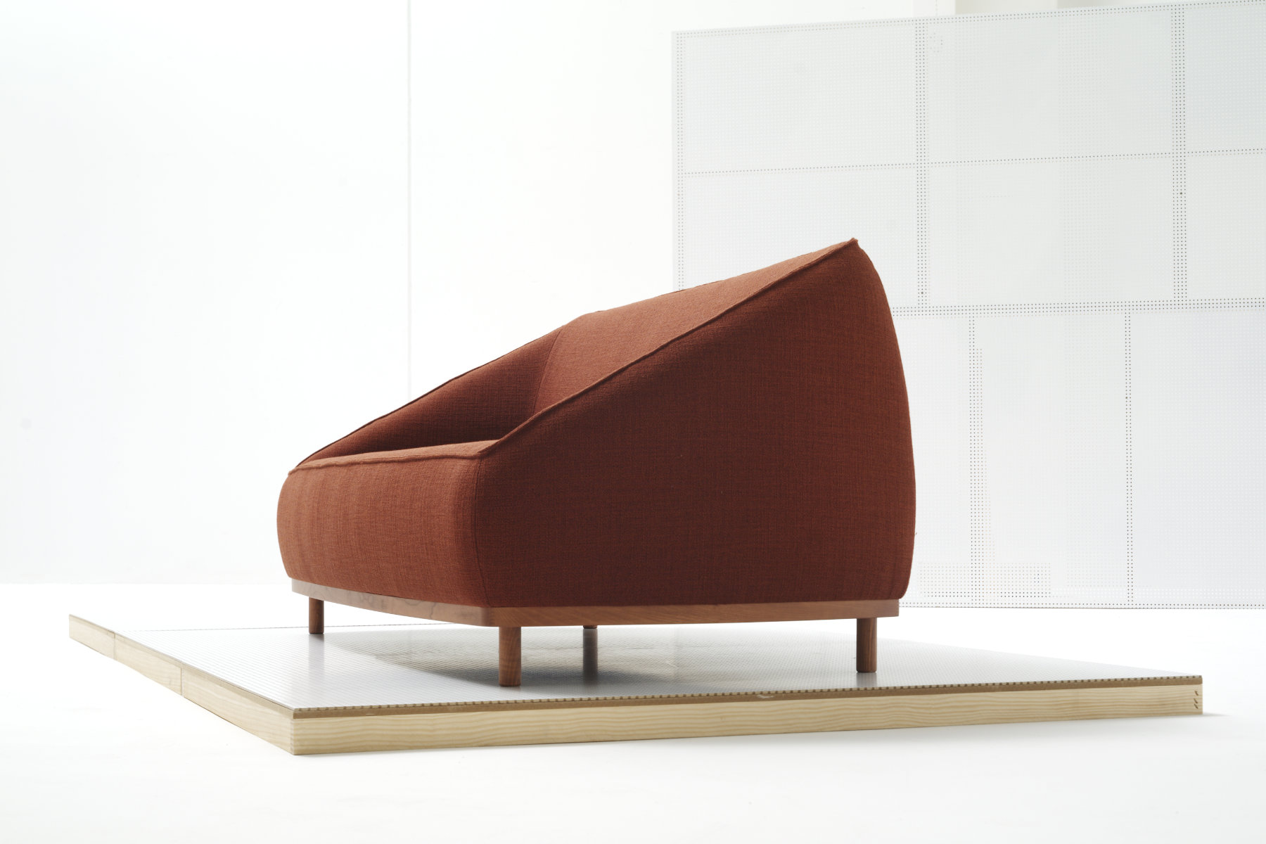 Sumo seating collection by Yonoh for Sancal with upholstered volumes and wooden base