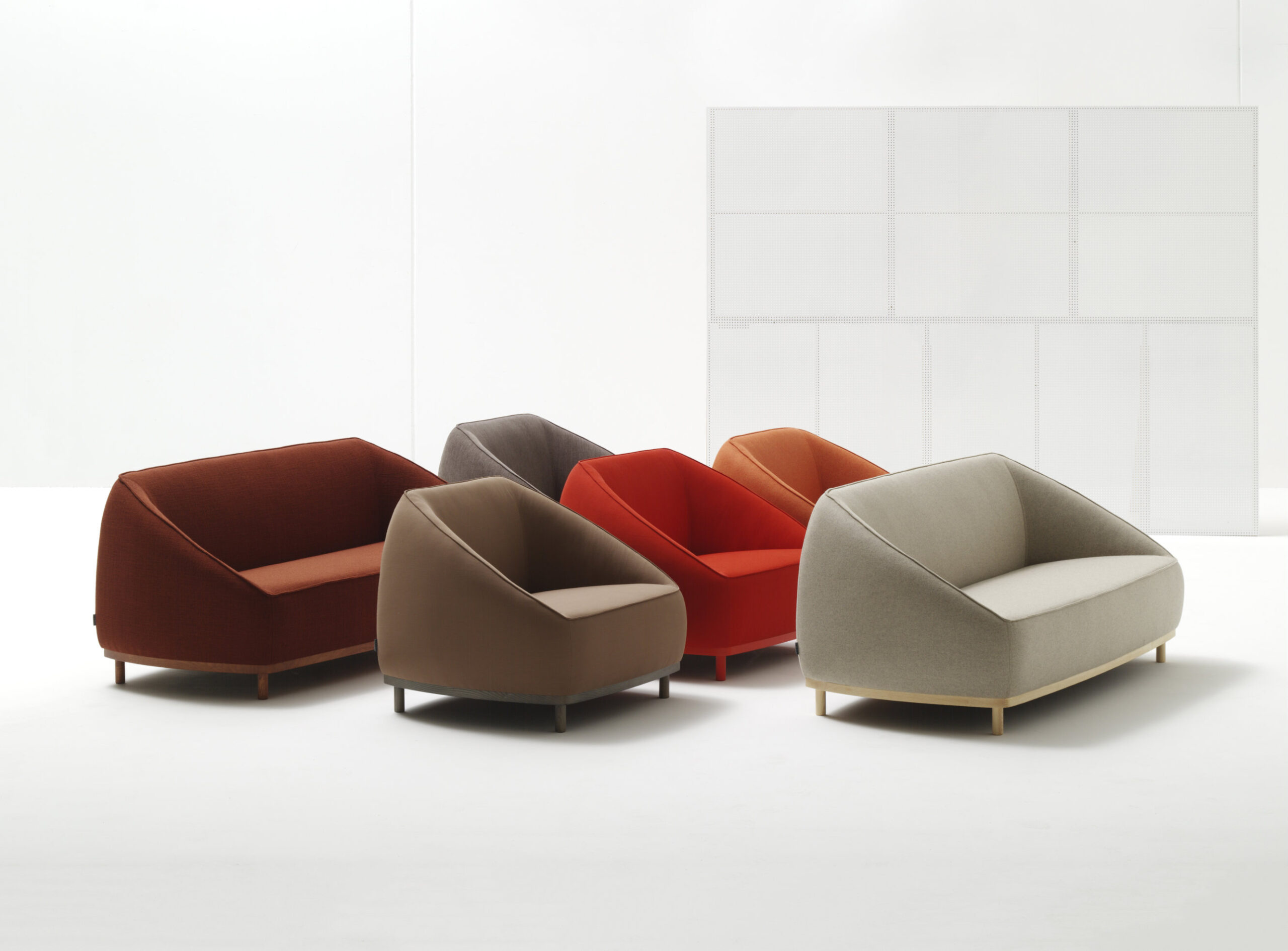 Sumo seating collection by Yonoh for Sancal with upholstered volumes and wooden base