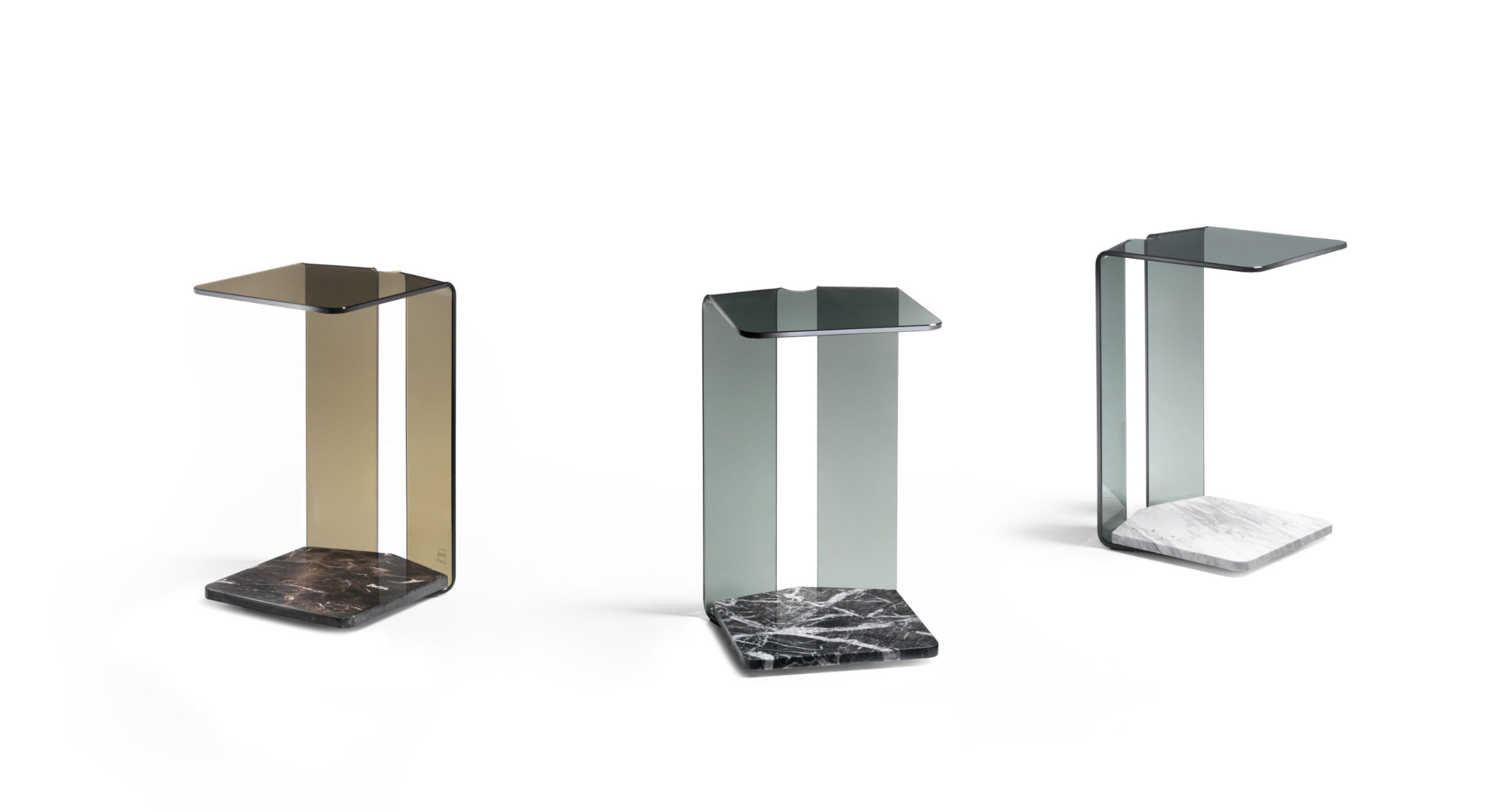 York glass side table with slender structural frame in contemporary interior