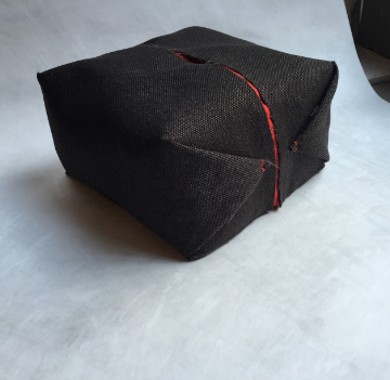 Ori pouf with soft organic silhouette in contemporary interior