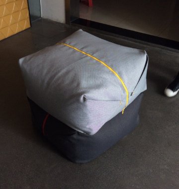 Ori pouf with soft organic silhouette in contemporary interior